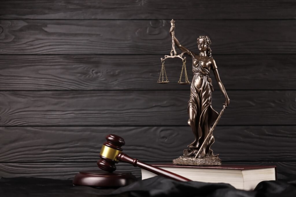 a statue of a woman holding a scale and a gavel