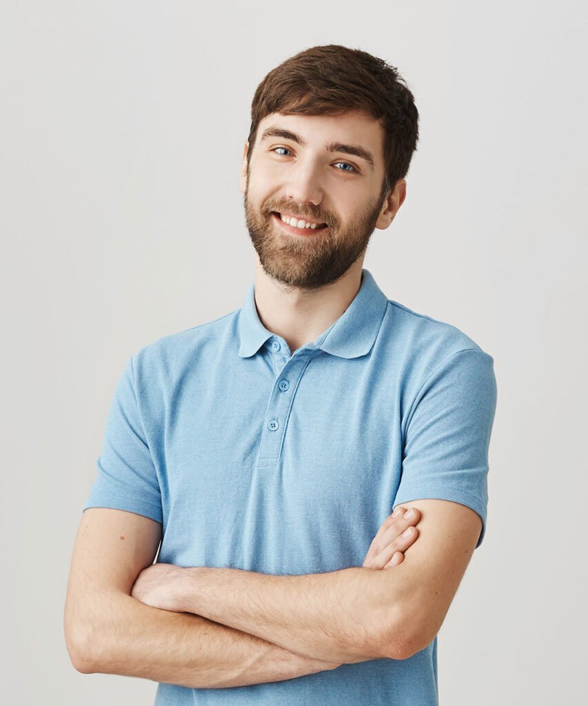 a man with a beard and mustache wearing a blue shirt